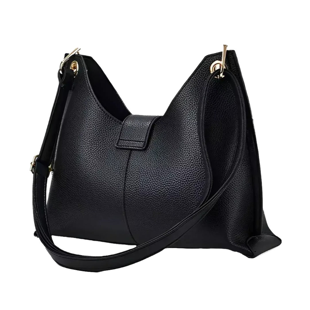 A black leather handbag with a curved shape and a gold-colored metal clasp on the top.