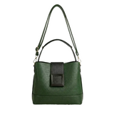 A green leather handbag with a black rectangular panel on the front.
