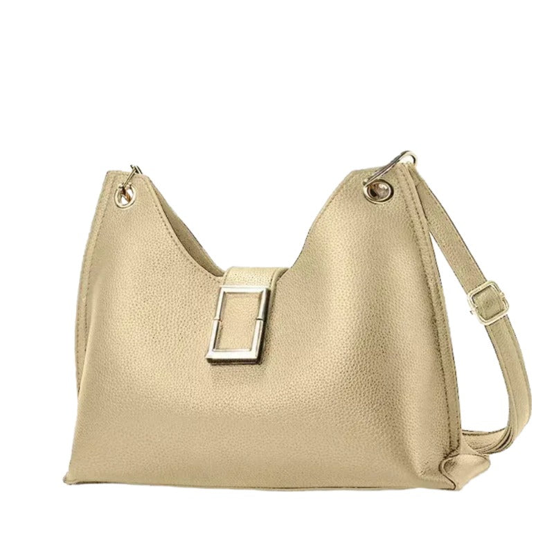 A tan leather handbag with a metal clasp and two metal straps.