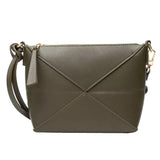 A small, rectangular, leather crossbody bag with a zipper closure and a gold-colored metal clasp.