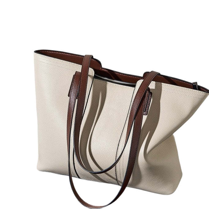 A tan leather tote bag with brown leather straps and a zipper closure.