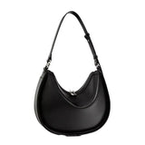 A black leather handbag with a curved shape and a strap.
