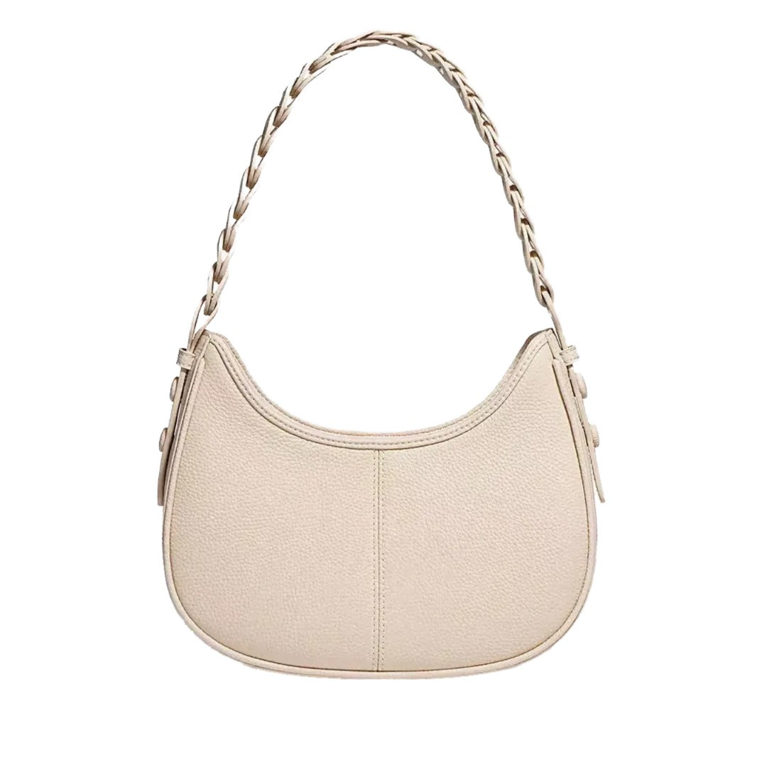 A beige leather handbag with a braided strap.