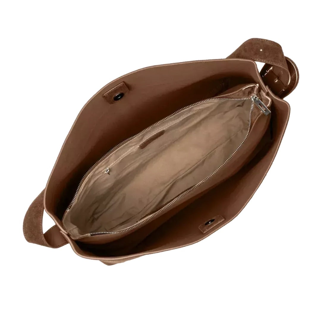 the interior of a brown leather handbag, with the zipper partially open and the interior visible.