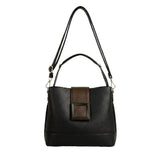 A black leather handbag with a brown leather accent detail and a black strap.