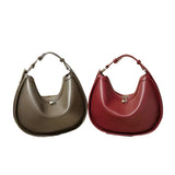 Two stylish handbags, one brown and one red, are displayed side by side against a white background.