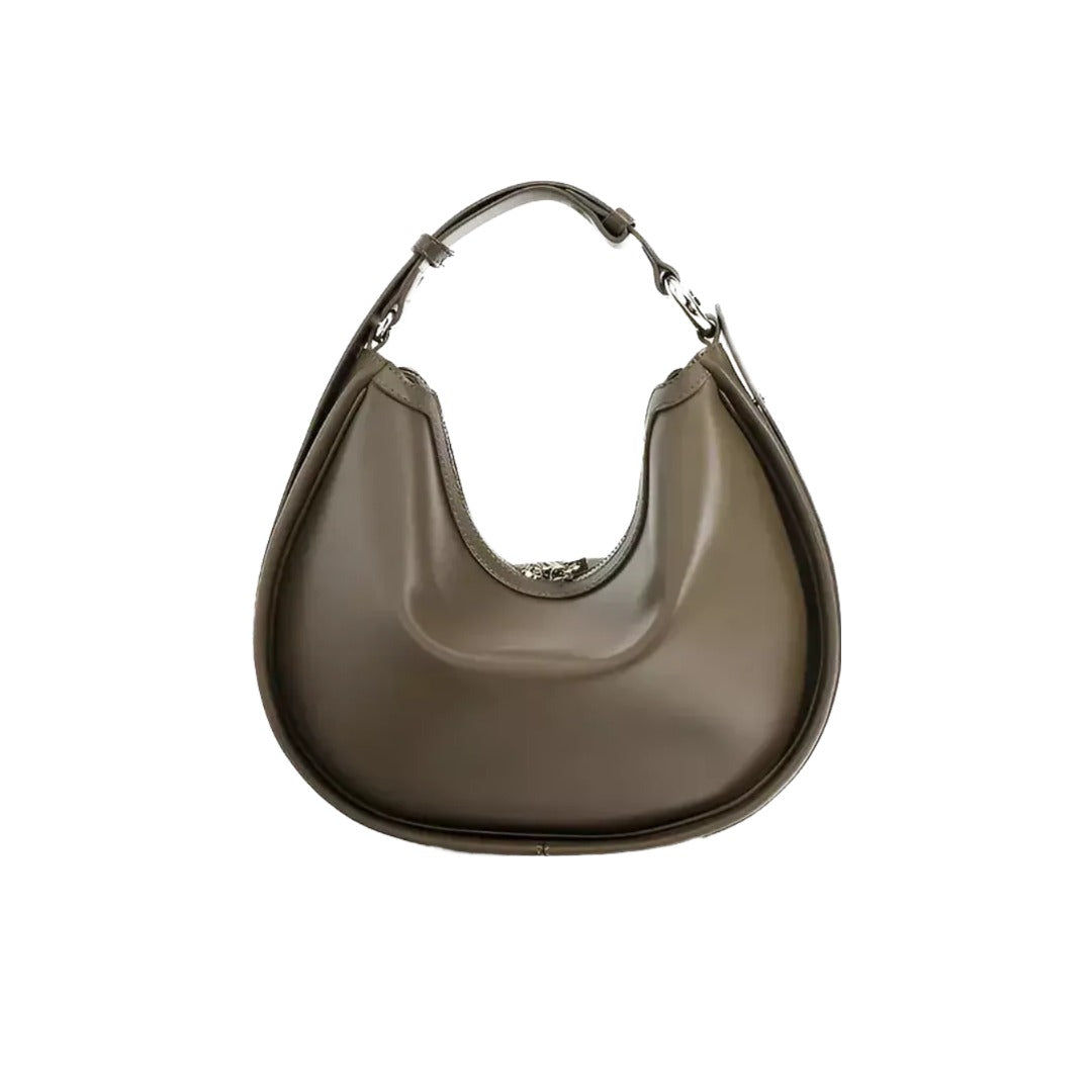 A brown leather handbag with a curved shape and a metal clasp on the top.