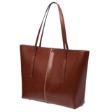 A brown leather tote bag with a curved handle and two vertical straps.