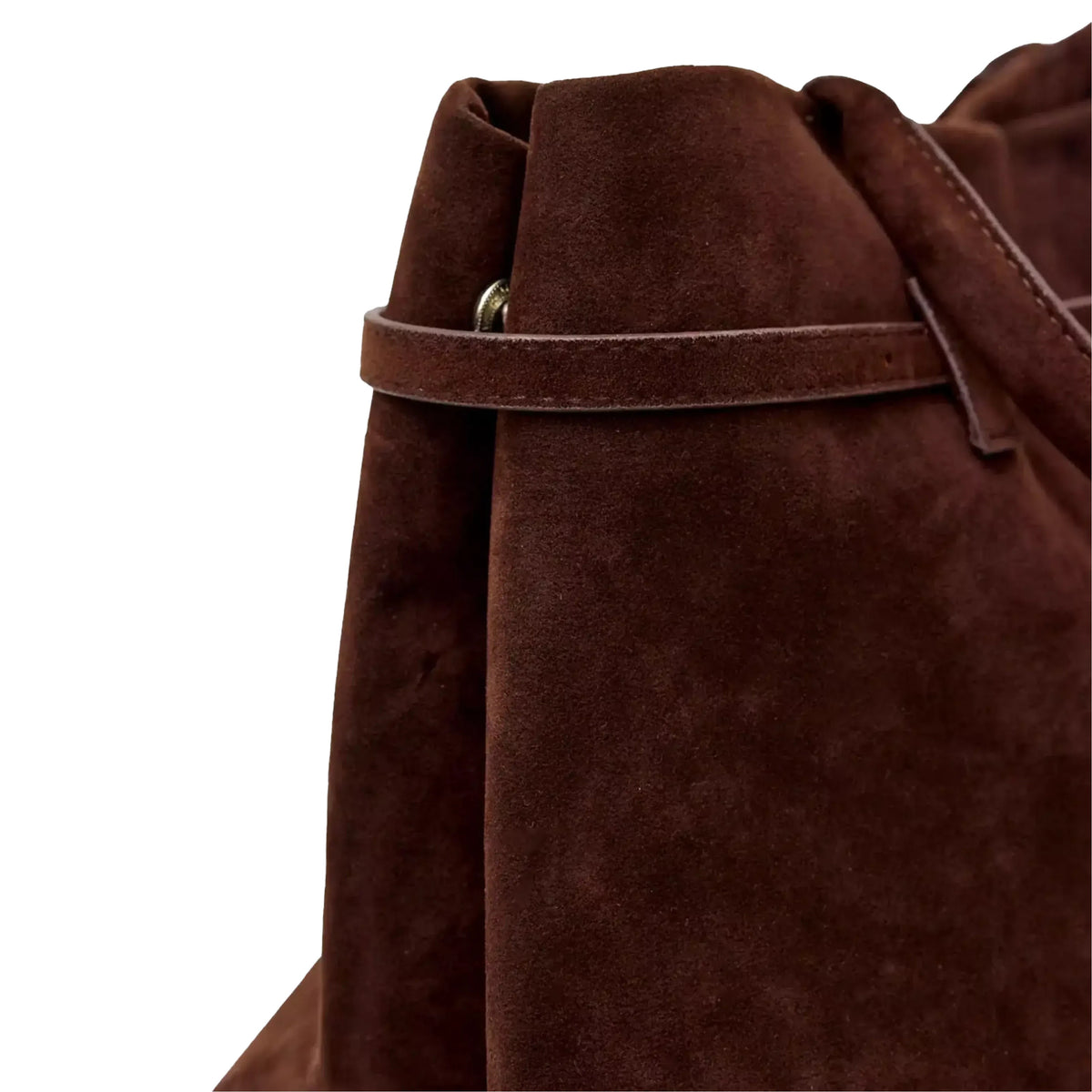 A close-up view of a brown suede bag, likely a purse or backpack, with a strap and buckle detail.