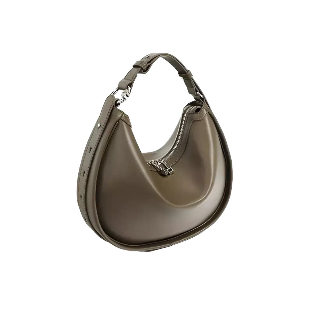 A brown leather handbag with a curved shape and a zipper closure.