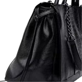 A black leather handbag with a chain strap and a drawstring closure.