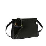 A black leather handbag with a gold-colored buckle detail.