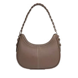A brown leather handbag with a curved shape and a braided strap.