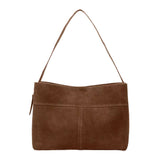A brown suede shoulder bag with a triangular strap.